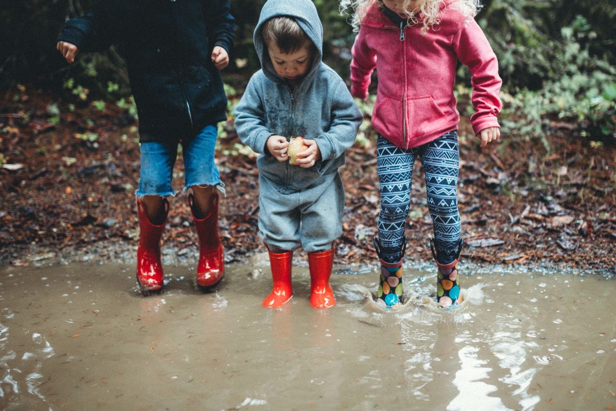 Children playing in a puddle.