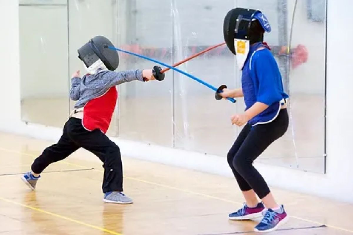 Two individuals fencing
